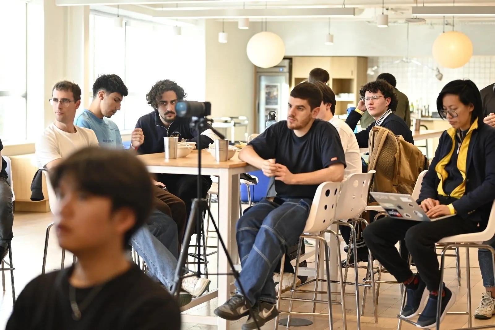 Teams presenting and listening in the Entrepreneur First space