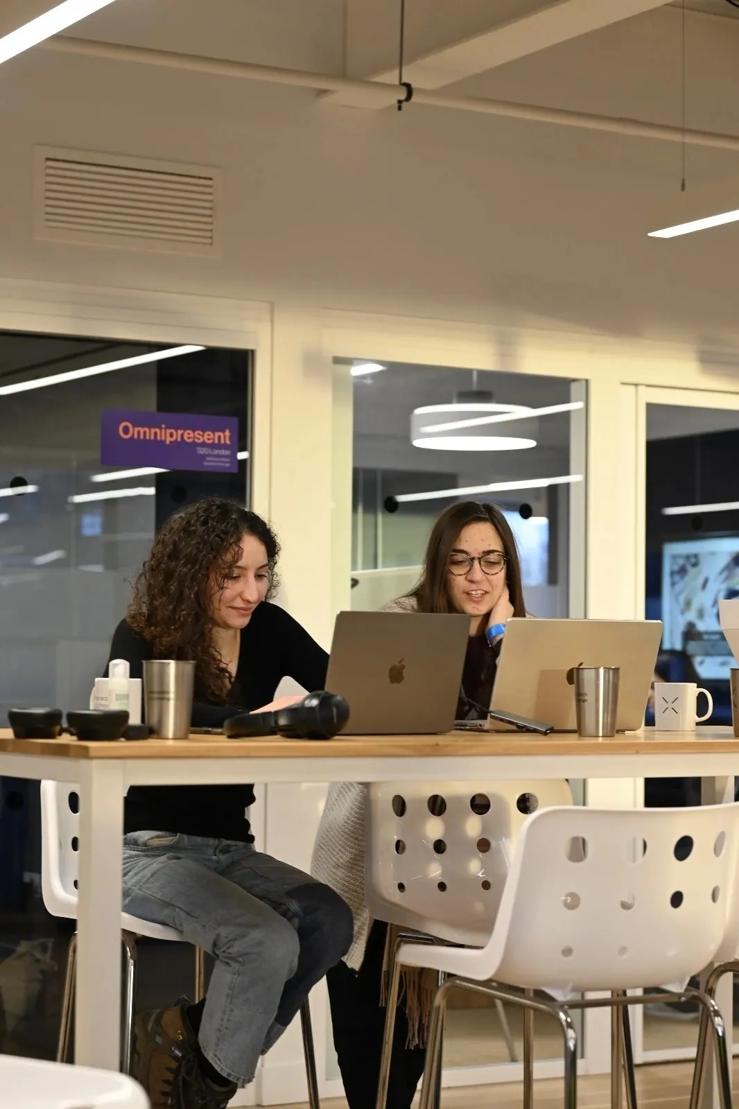 Participants working at tables during the hackathon